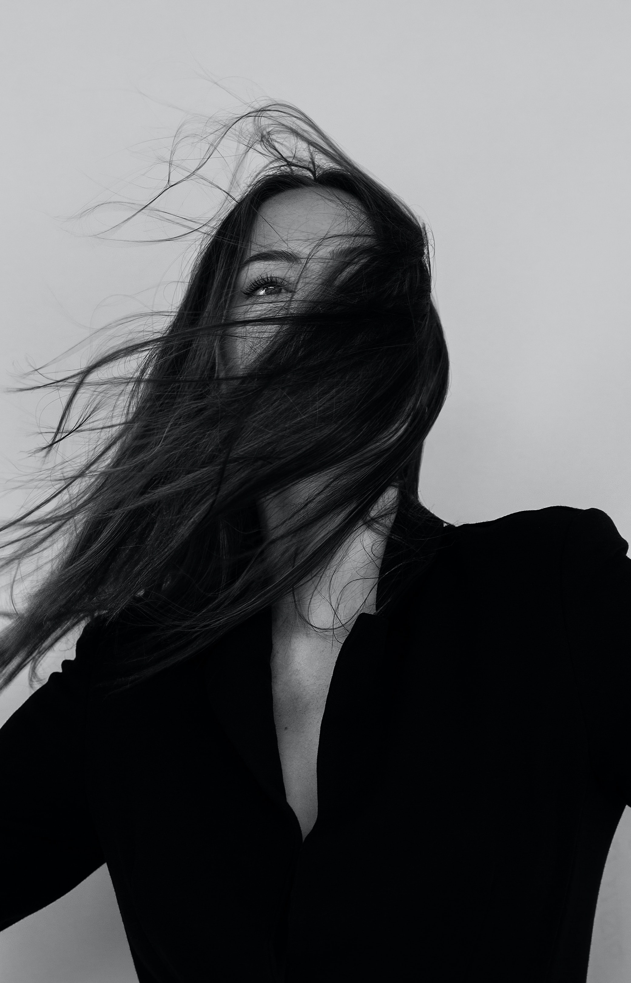 Black and white portrait with long, flowing hair